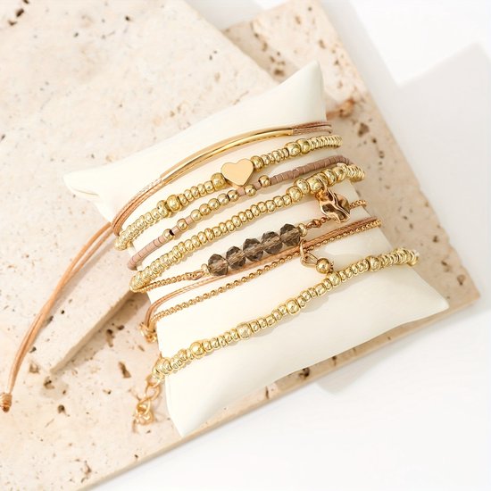 Sjika - Gold plated armbanden set – 7-delige damesarmbanden met kralen, bedels & hartdetail – Boho chic & elegant design – Perfect cadeau voor haar