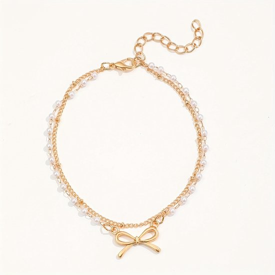 Sjika - Enkelbandje Dames Goudkleurig met Strik & Parels – Dubbele Enkelband – Trendy Zomer Enkelketting – Boho Voetsieraad - Cadeau voor haar