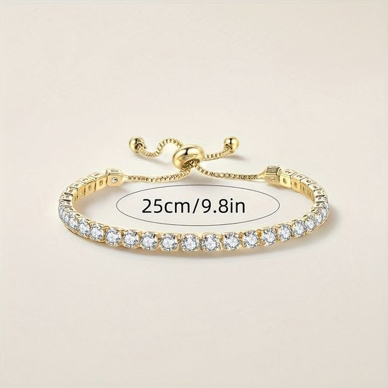 Sjika - Gold plated tennisarmband met zirkonia – Luxe verstelbare damesarmband – Elegant & fonkelend design – Perfect cadeau voor haar