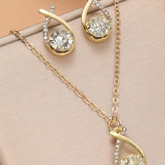 Sjika - Goudkleurige Sieraden Set Dames – Ketting & Oorbellen met Kristal Steen – Elegante Strass Sieraden Set – Luxe Cadeauset voor Haar