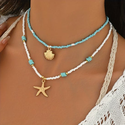 Sjika - Bohemian Strand Ketting Dames – 2 Delige Kralen Ketting Set met Zeester & Schelp Hanger – Zomer Choker Kettingen Wit Blauw Goud - Cadeau voor haar