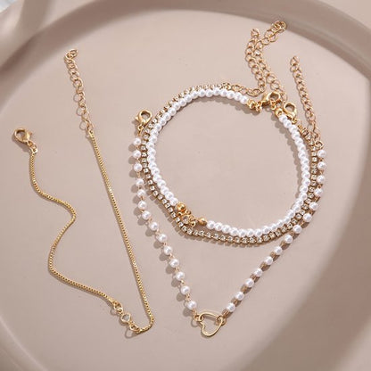 Sjika - Gouden Armbandenset Dames – 4 Delige Set met Parels, Hartje & Zirkonia – Luxe Layered Armbanden – Verstelbaar - Cadeau voor haar