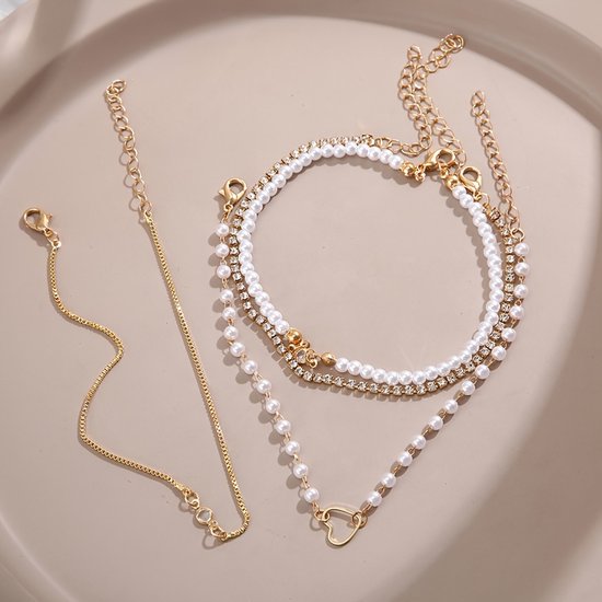 Sjika - Gouden Armbandenset Dames – 4 Delige Set met Parels, Hartje & Zirkonia – Luxe Layered Armbanden – Verstelbaar - Cadeau voor haar