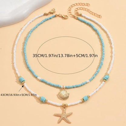 Sjika - Bohemian Strand Ketting Dames – 2 Delige Kralen Ketting Set met Zeester & Schelp Hanger – Zomer Choker Kettingen Wit Blauw Goud - Cadeau voor haar