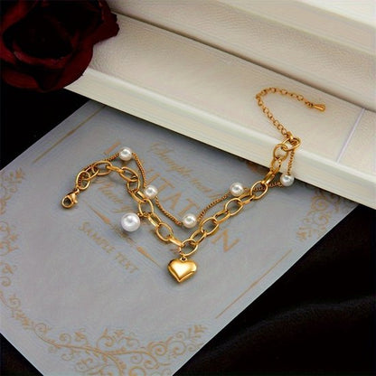 Sjika - Gold plated armband met parels & hartbedel – Luxe damesarmband – Trendy schakel design – Perfect cadeau voor haar