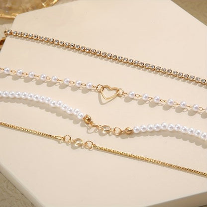 Sjika - Gouden Armbandenset Dames – 4 Delige Set met Parels, Hartje & Zirkonia – Luxe Layered Armbanden – Verstelbaar - Cadeau voor haar