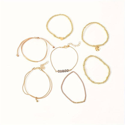 Sjika - Gold plated armbanden set – 7-delige damesarmbanden met kralen, bedels & hartdetail – Boho chic & elegant design – Perfect cadeau voor haar