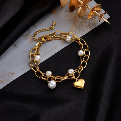 Sjika - Gold plated armband met parels & hartbedel – Luxe damesarmband – Trendy schakel design – Perfect cadeau voor haar