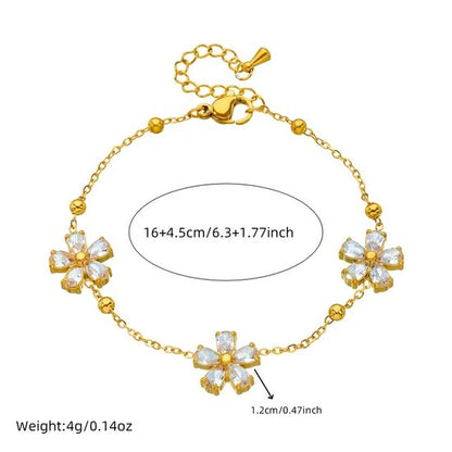 Sjika - Dames Armband – Goudkleurig met Kristal Bloemen – Luxe Sieraad - Cadeau