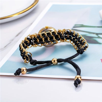Sjika - Trendy Goudkleurig Dames Horloge – Armband Stijl – Quartz Uurwerk – Zwart Vlechtkoord & Kristallen - Cadeau voor haar