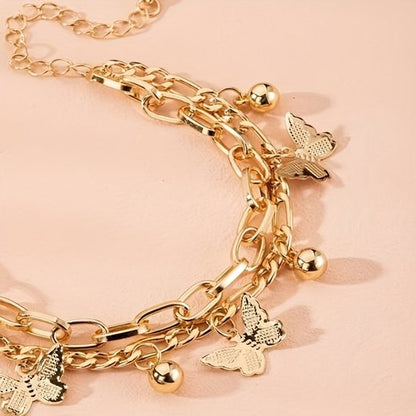 Sjika - Gouden Vlinder Armband Dames – Schakelarmband met Bedels – Verstelbare Armband – Trendy Sieraad – Gold Plated