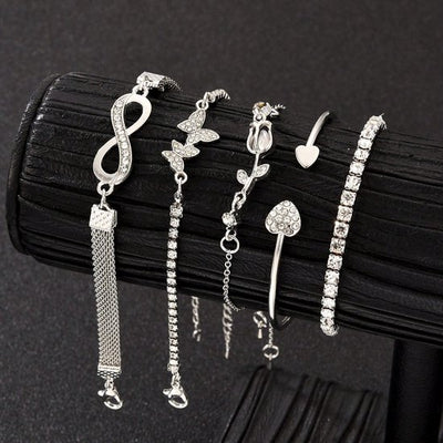 Sjika - 4 Delige Dames Armband Set Zilverkleurig – Infinity, Hart & Vlinder Armbanden – Strass Tennis Armband – Trendy Sieraden Set voor Dames - Cadeau voor haar