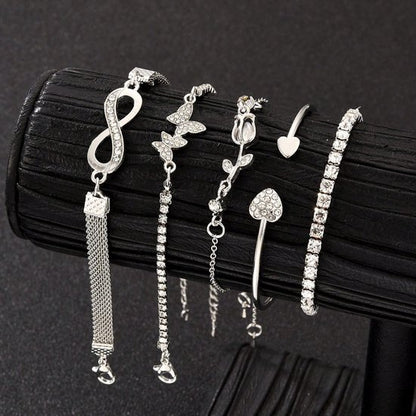 Sjika - 4 Delige Dames Armband Set Zilverkleurig – Infinity, Hart & Vlinder Armbanden – Strass Tennis Armband – Trendy Sieraden Set voor Dames - Cadeau voor haar