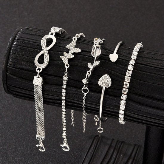 Sjika - 4 Delige Dames Armband Set Zilverkleurig – Infinity, Hart & Vlinder Armbanden – Strass Tennis Armband – Trendy Sieraden Set voor Dames - Cadeau voor haar