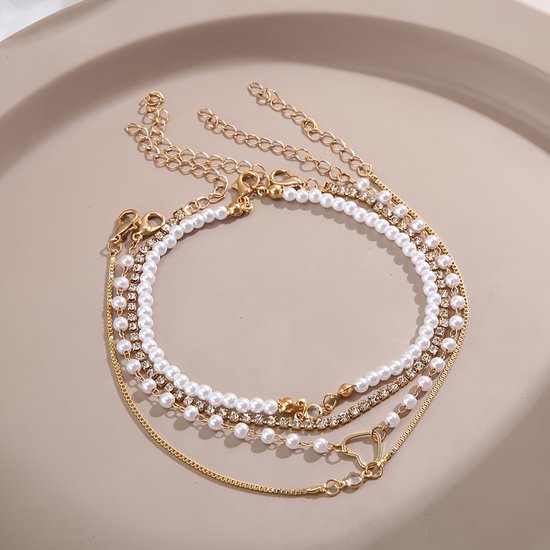 Sjika - Gouden Armbandenset Dames – 4 Delige Set met Parels, Hartje & Zirkonia – Luxe Layered Armbanden – Verstelbaar - Cadeau voor haar