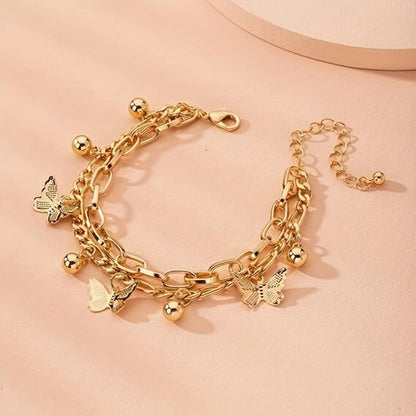 Sjika - Gouden Vlinder Armband Dames – Schakelarmband met Bedels – Verstelbare Armband – Trendy Sieraad – Gold Plated