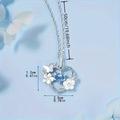Sjika - Hart Ketting Dames Zilverkleurig – Vlinder & Bloem Hanger met Blauwe Kristal Steen – Elegante Dames Ketting – Romantisch Cadeau voor Haar