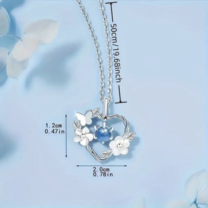 Sjika - Hart Ketting Dames Zilverkleurig – Vlinder & Bloem Hanger met Blauwe Kristal Steen – Elegante Dames Ketting – Romantisch Cadeau voor Haar