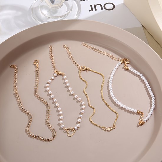 Sjika - Gouden Armbandenset Dames – 4 Delige Set met Parels, Hartje & Zirkonia – Luxe Layered Armbanden – Verstelbaar - Cadeau voor haar