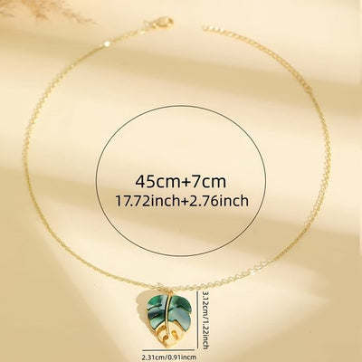 Sjika - Blad Ketting Dames Goudkleurig – Tropische Monstera Hanger Groen – Minimalistische Dames Ketting – Trendy Bohemian Sieraad - Cadeau voor haar