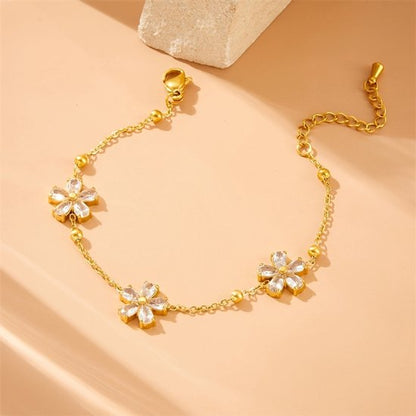 Sjika - Dames Armband – Goudkleurig met Kristal Bloemen – Luxe Sieraad - Cadeau