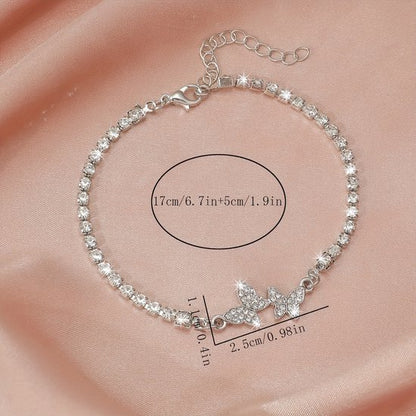 Sjika - Zilverkleurige armband met vlinders & zirkonia – Luxe dames tennisarmband – Elegant & fonkelend design – Perfect cadeau voor haar