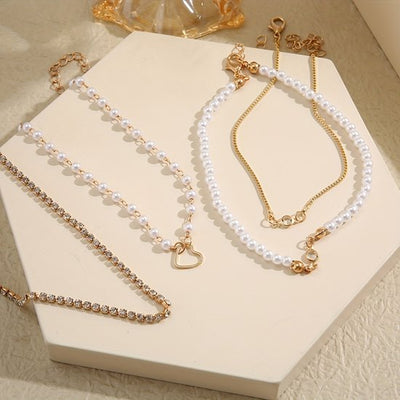 Sjika - Gouden Armbandenset Dames – 4 Delige Set met Parels, Hartje & Zirkonia – Luxe Layered Armbanden – Verstelbaar - Cadeau voor haar
